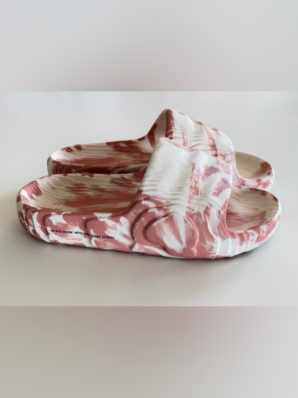 Adidas Adilette 22 slides in the Ivory and Solar Red